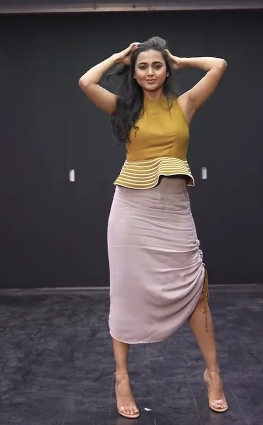 Tejaswi Prakash in French Ochre Backless Peplum Top With Sepia Grey  Asymmetric Skirt